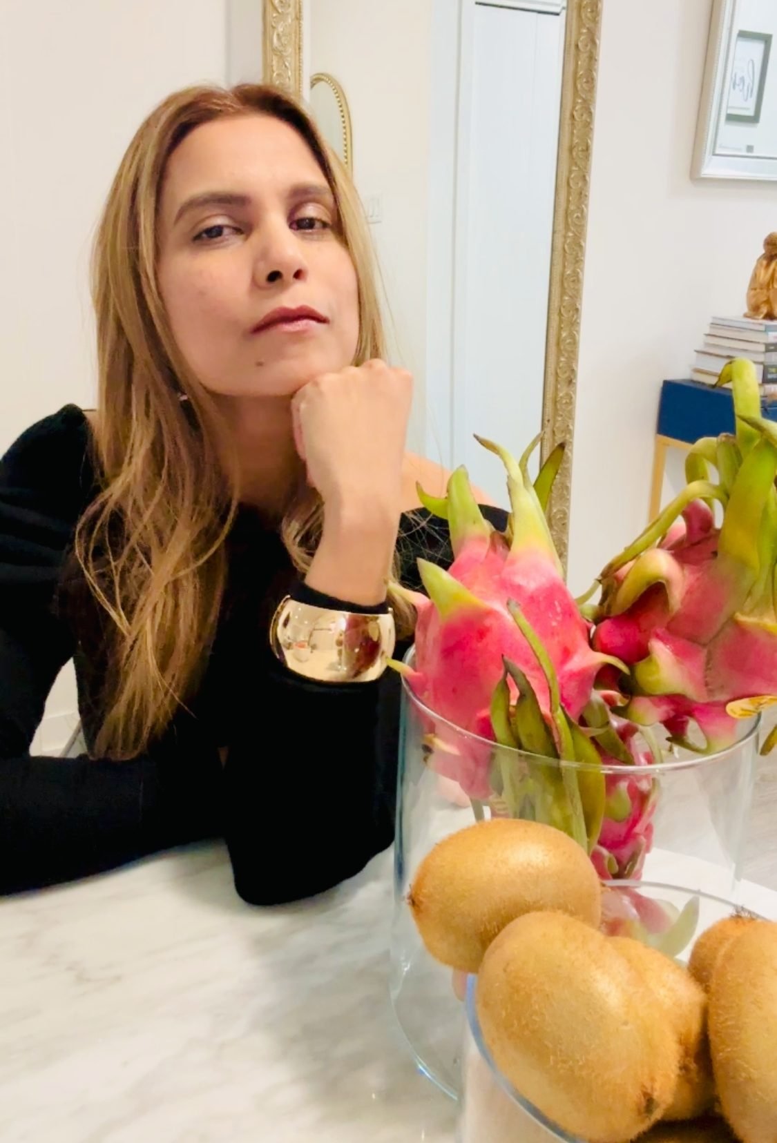 Krupa Patel at a table with fresh fruit