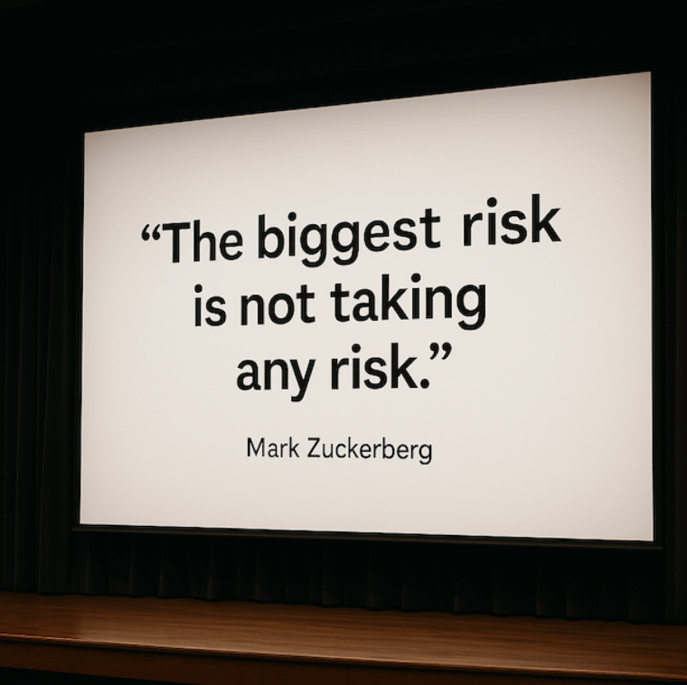 Mark Zuckerberg quote projected on a large screen: “The biggest risk is not taking any risk.”