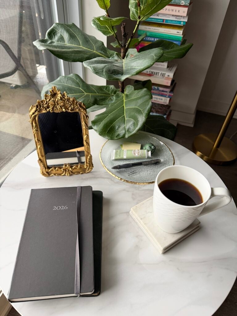 Coffee, planner, and journal representing mental clarity, reflection, and intentional living