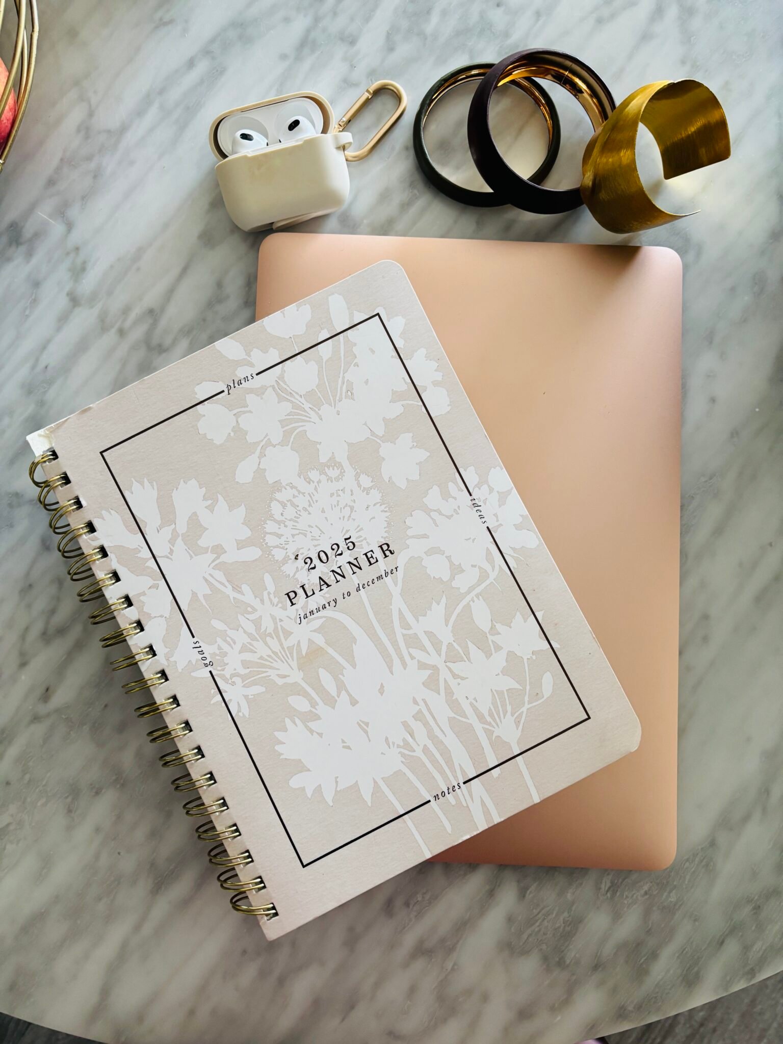 Minimal planner and laptop setup representing systems and structure for entrepreneurial success