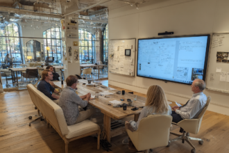 Business team reviewing systems and processes to scale company growth sustainably