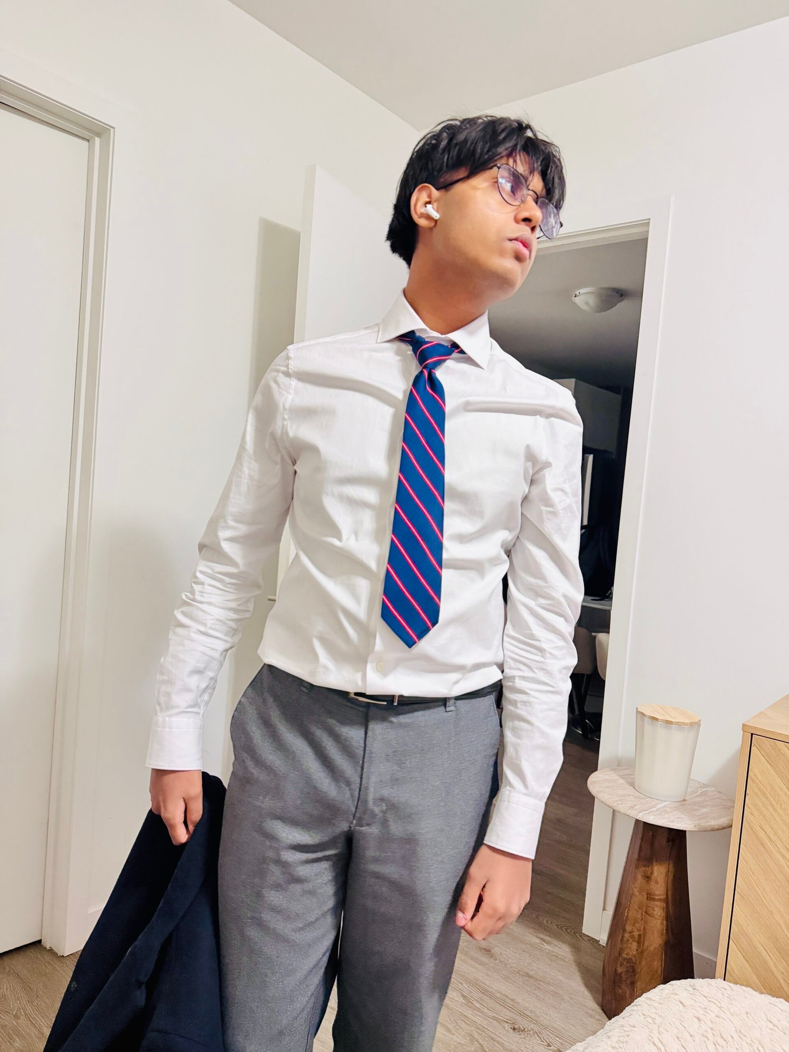 Teenage son dressed professionally, representing preparedness, discipline, and values learned through parenting by example