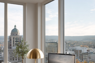 Beautiful home office with a wooden desk and an elegant upholstered desk chair in warm light.